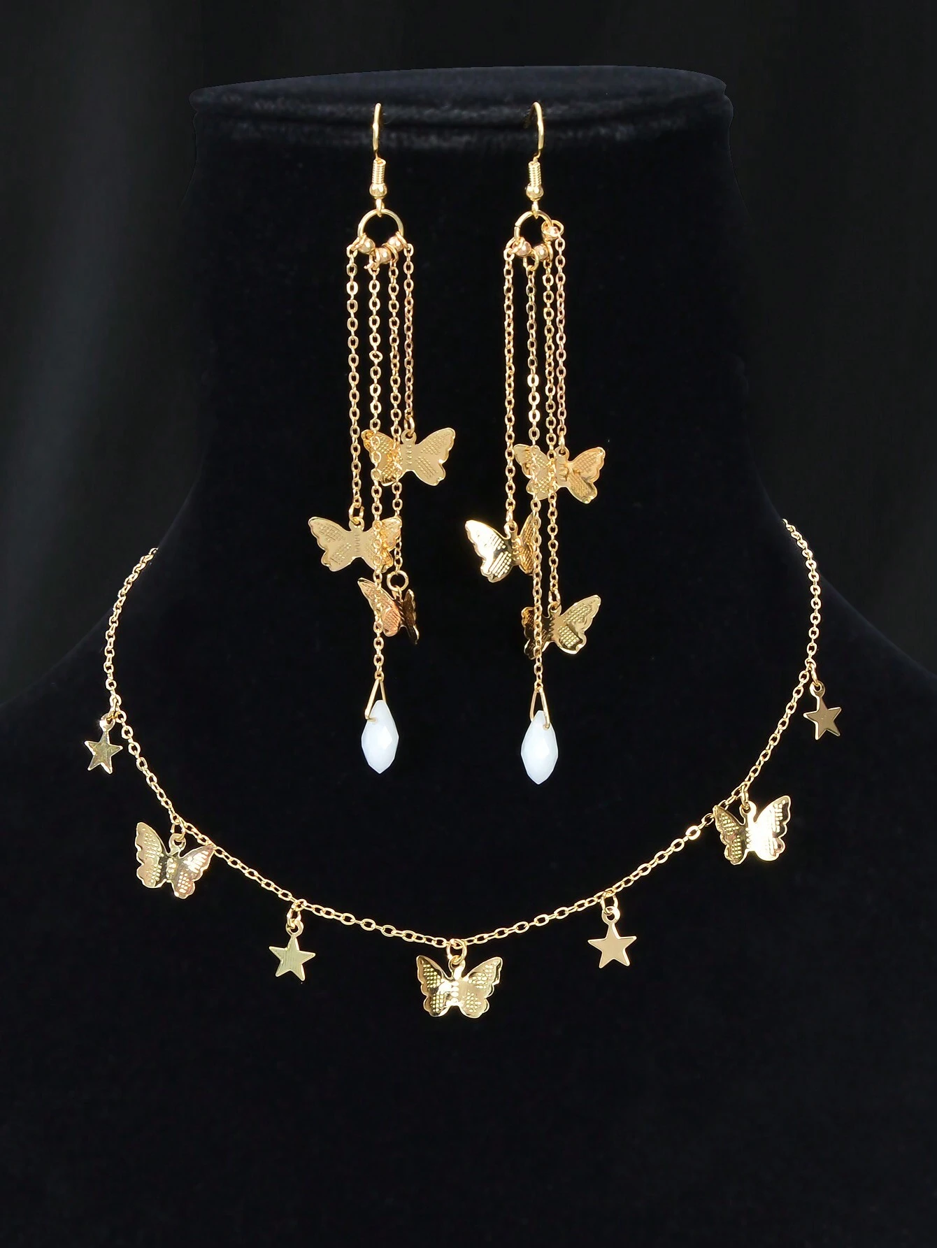 3 Pieces of party jewelry with gold chains and butterfly designs