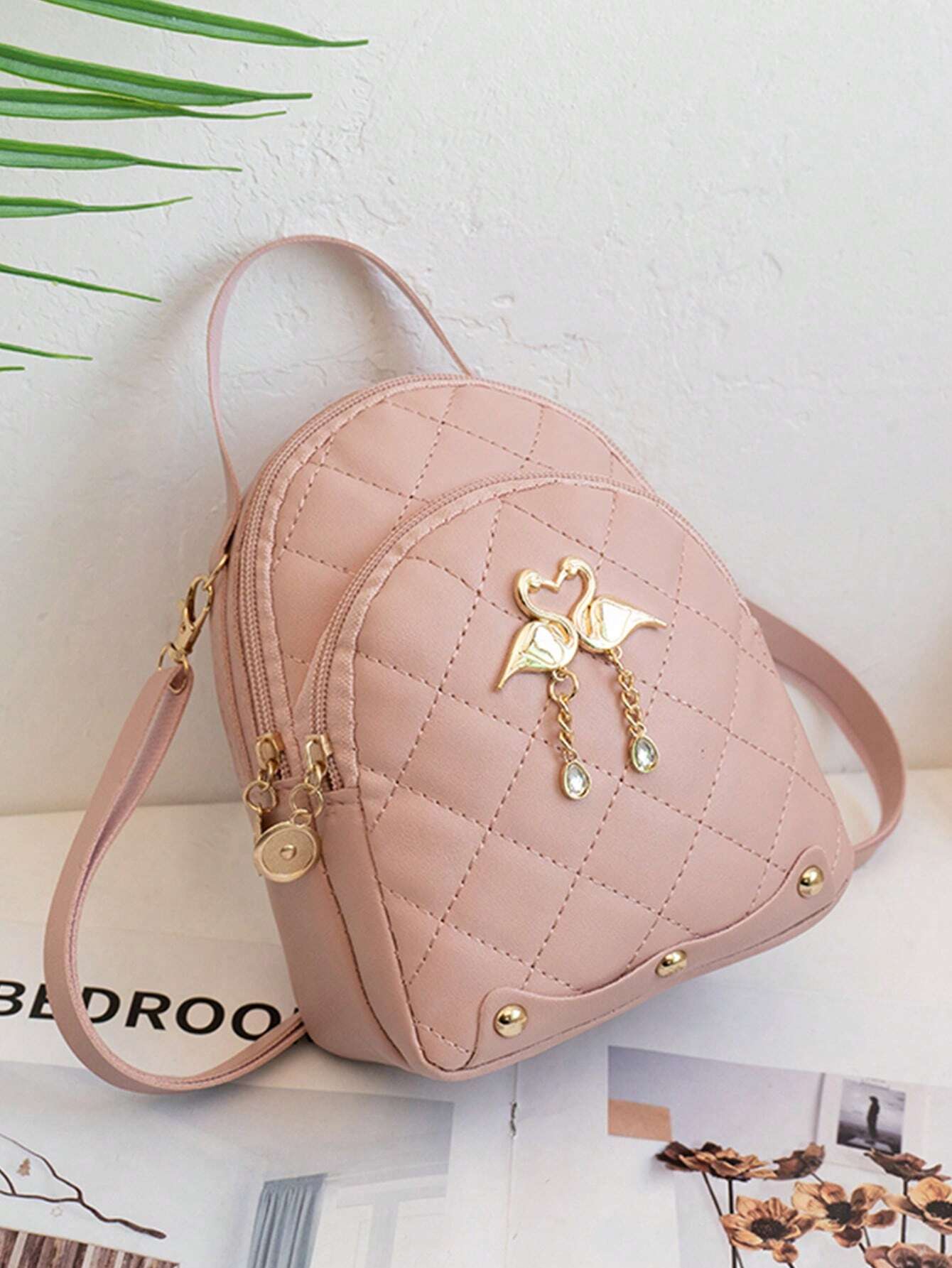 A Mini Quilted Backpack, A Mini Swan Hardware Decoration